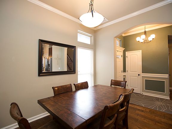 Dining opens to kitchen.