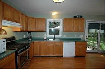Door from the kitchen leads to the large back deck