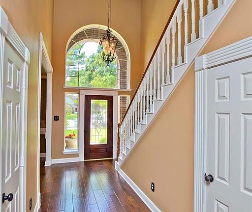 Details everywhere you look, wood floors throughout, 5" base boards, dental, fluted and crown moldings, custom iron chandelier with a medallion ceiling treatment.