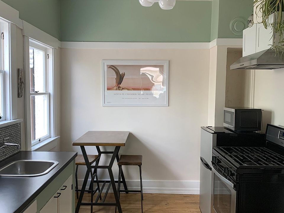 Full size gas range, small fridge and microwave. Seating for 2.