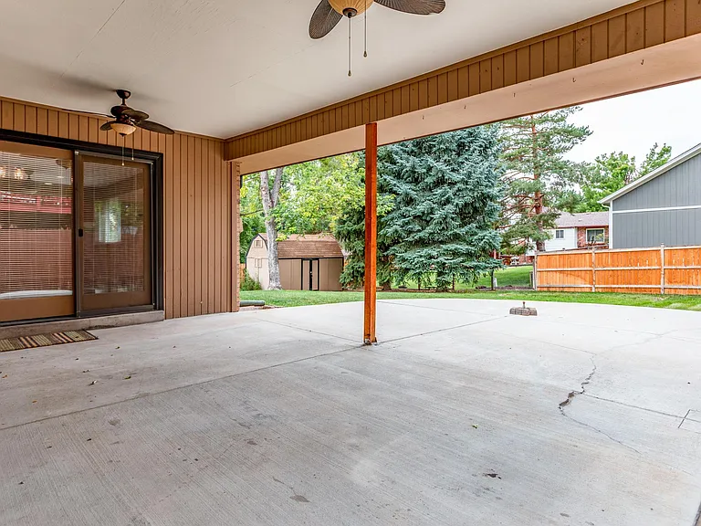Covered patio off dining room with ceiling fans