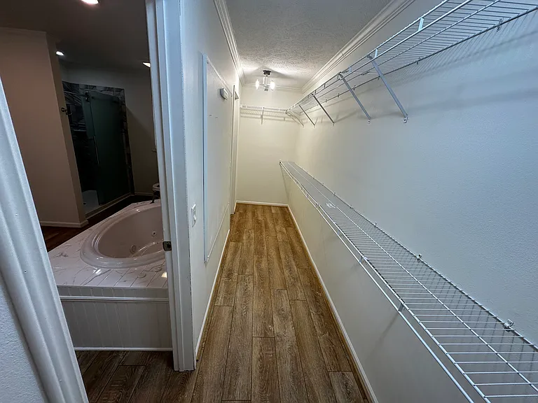 Walk in closet in Master bath, full length of the master bath.