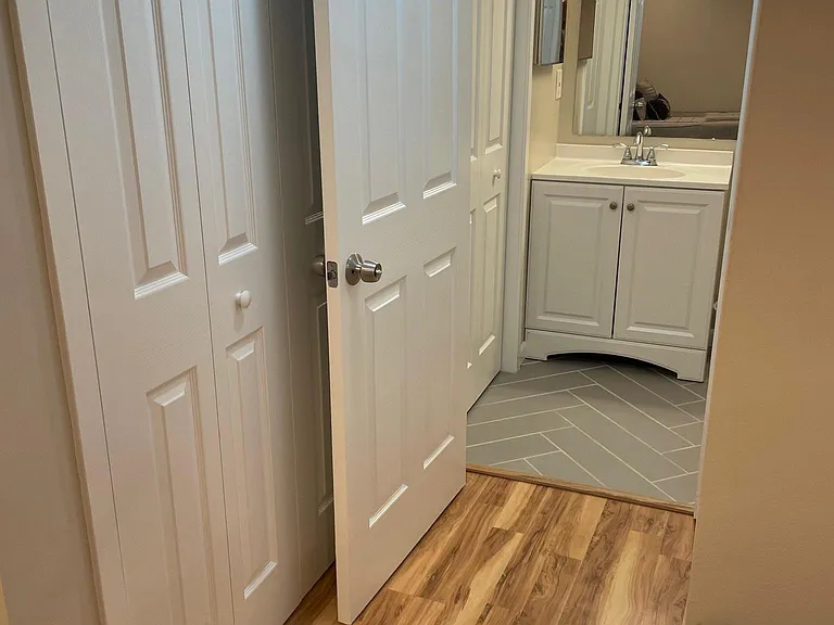 Full size bathroom adjacent to bedroom