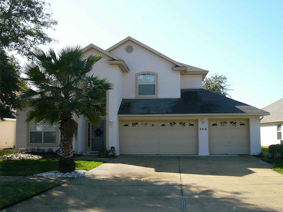 Front yard, large 3 car garage