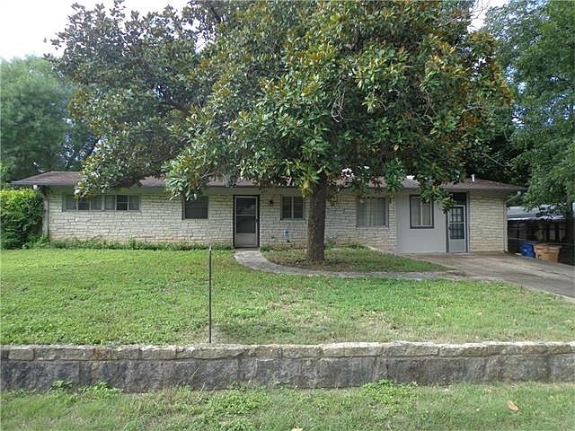 603 Meadow Lark Avenue. Mid 1950s home ready for your remodeling project. Huge magnolia tree in front.