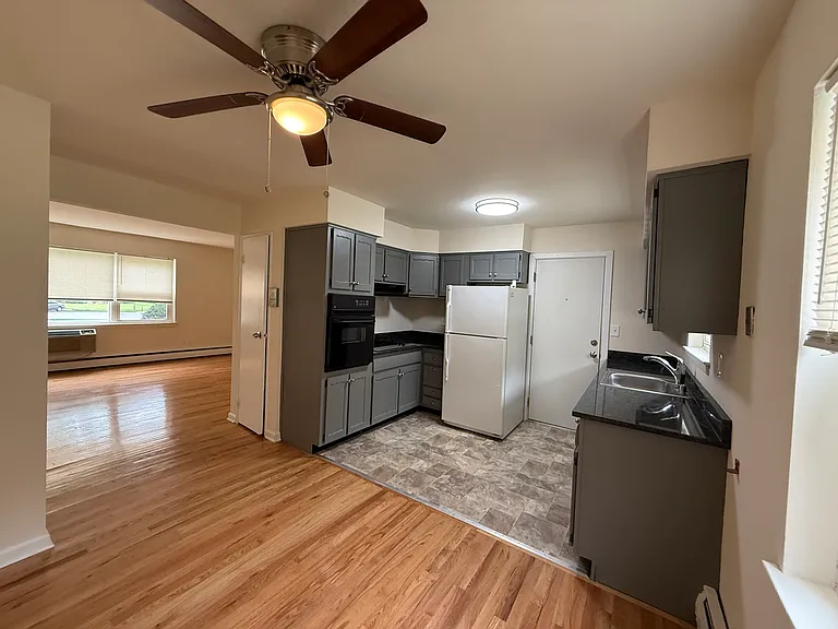 Kitchen with new SS Refrigerator.