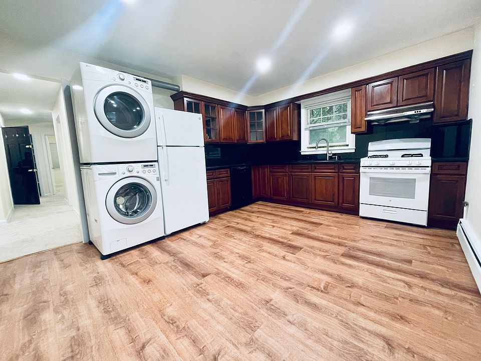 HUGE eat in kitchen with laundry, dishwasher and lots of sunlight