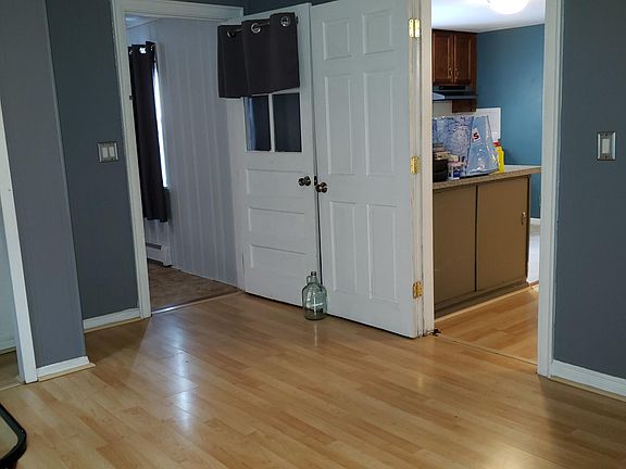 view from living space into the kitchen and sunroom
