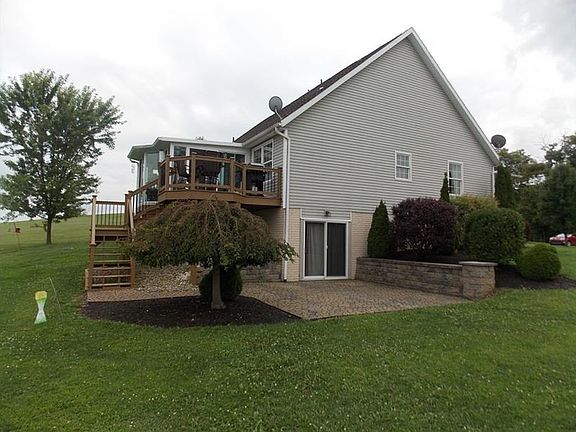 Side patio with sliding doors into the full basement.