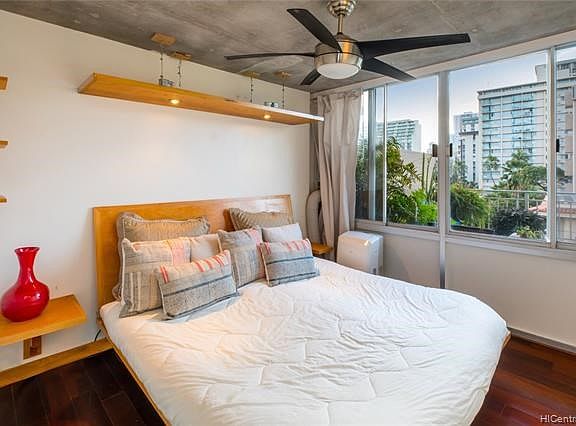 The master bedroom has beautiful built in shelves and King bed (which could be removed) with double reading lights and a WALK IN CLOSET to the left of the bed.  Nice views and tradewinds.