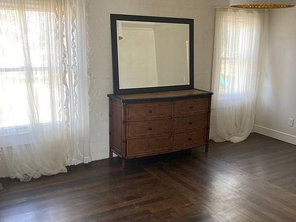 Master bedroom with area for a desk and a walk-in closet.