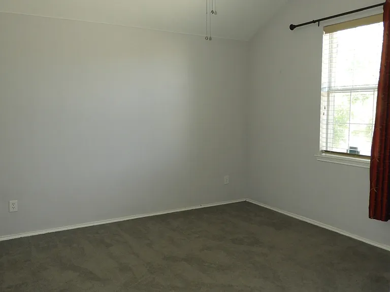 Bedroom #2 with ceiling fan.