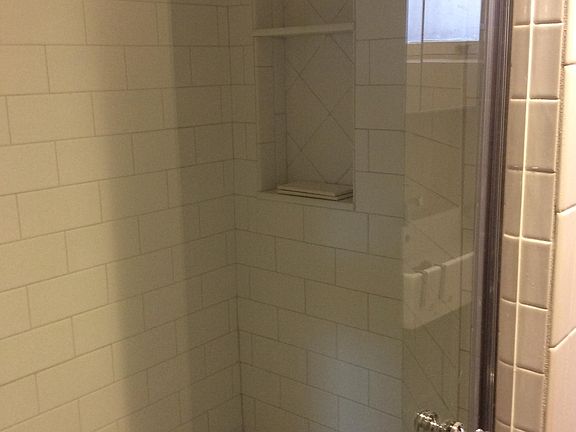 Seat and storage nook in shower