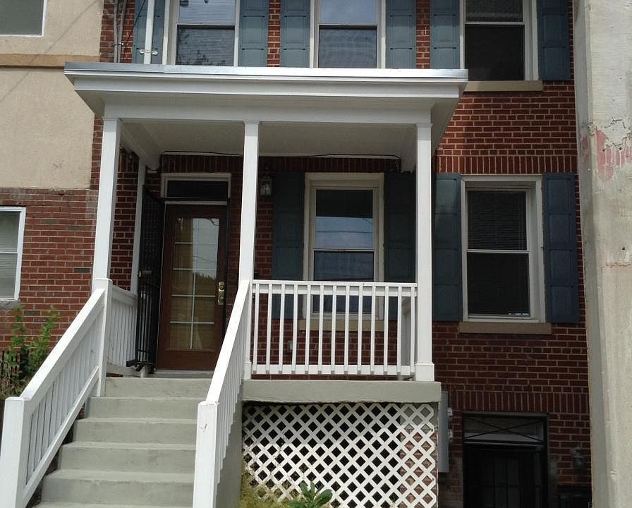 Spacious apartment has first and second floors. Front porch for relaxing and chatting.