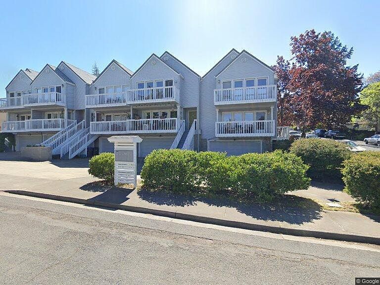 The townhouse is on the far right which has the huge view and being the corner unit, it has windows and main door on the low traffic street with trees for privacy.
