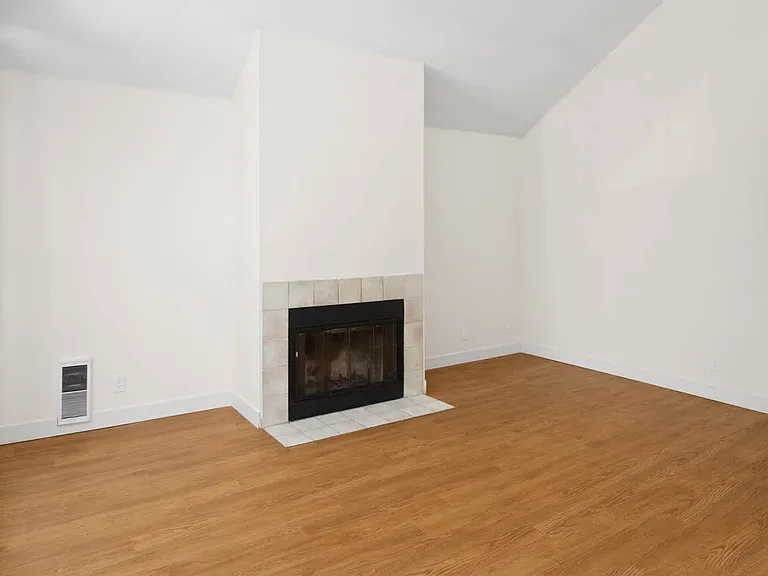 Living Room with Fireplace and Hard Surface Flooring