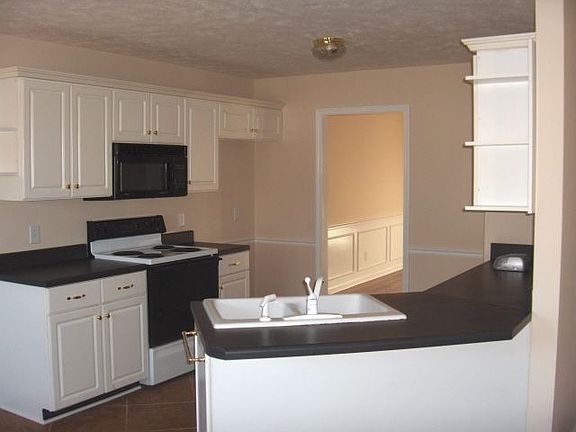 Open Kitchen with eating area behind photographer