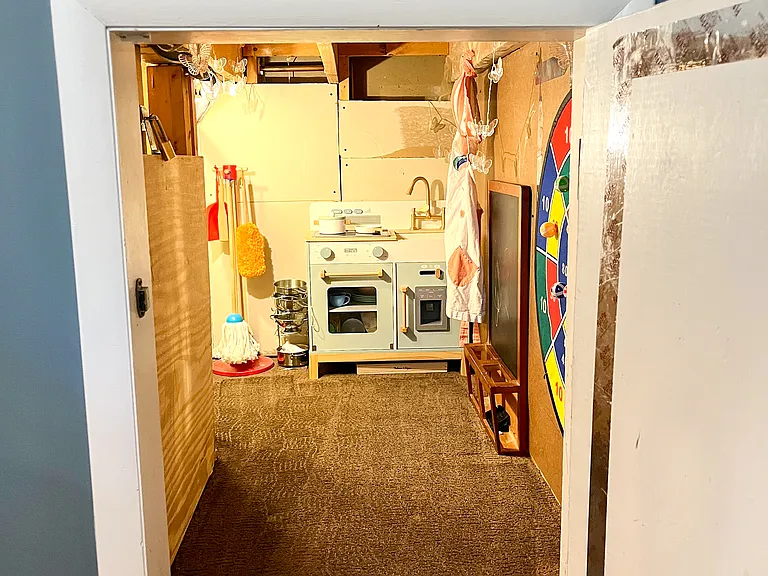 Small play area or storage area under stairs