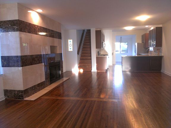 Living Room with Granite-face Wood Burning Fireplace