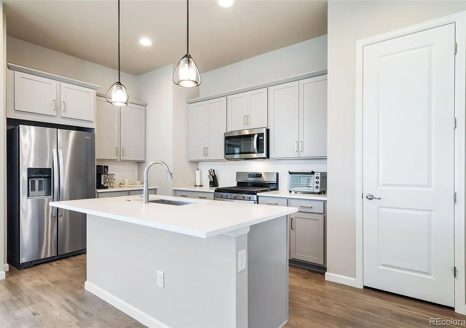 New ranch style home with a finished basement, spacious primary suite, open kitchen, & profession... — Photo 3