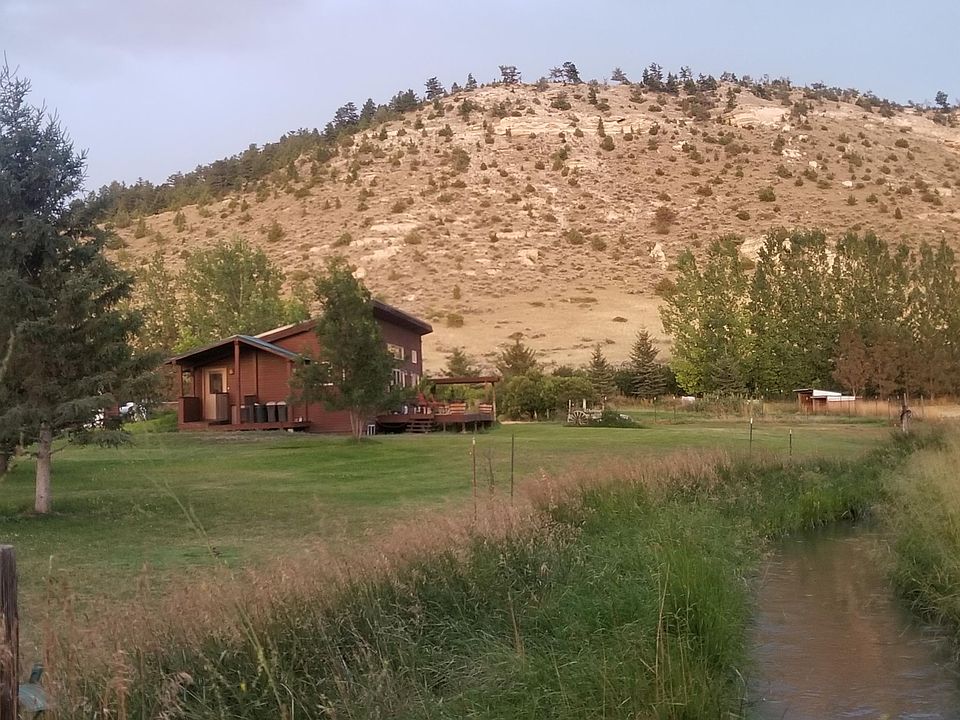 The view of the guest house. The basement level is below ground which helps keep it cool in the summer. (Notice the earthburmed north side.)