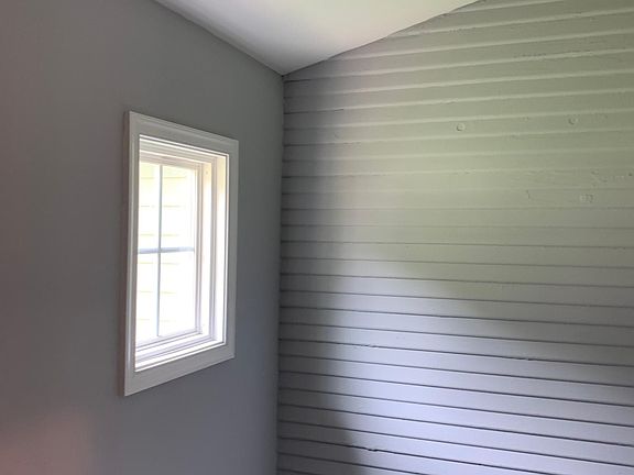 Enclosed area off kitchen with brand new washer and dryer, and ample storage space.