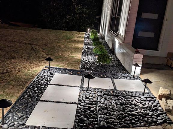 Professional modern landscaping and automated lights.