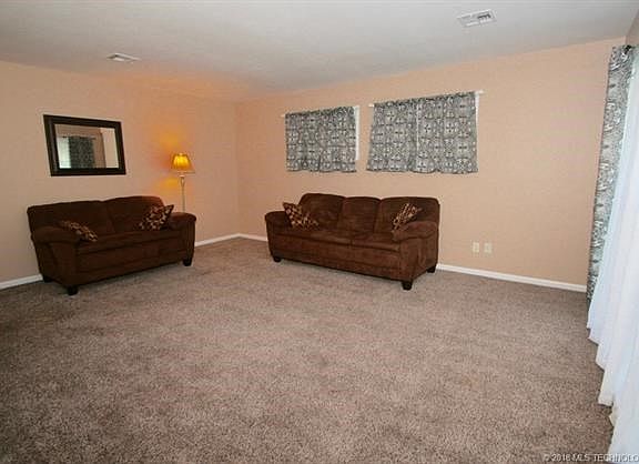 Family Room: Vinyl thermal windows look great & keep home quiet.