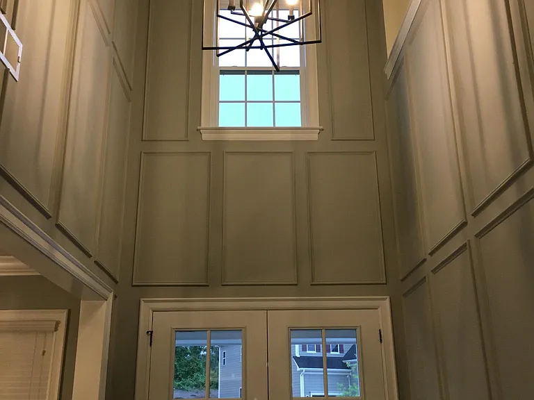 Double-story foyer entry with moulding