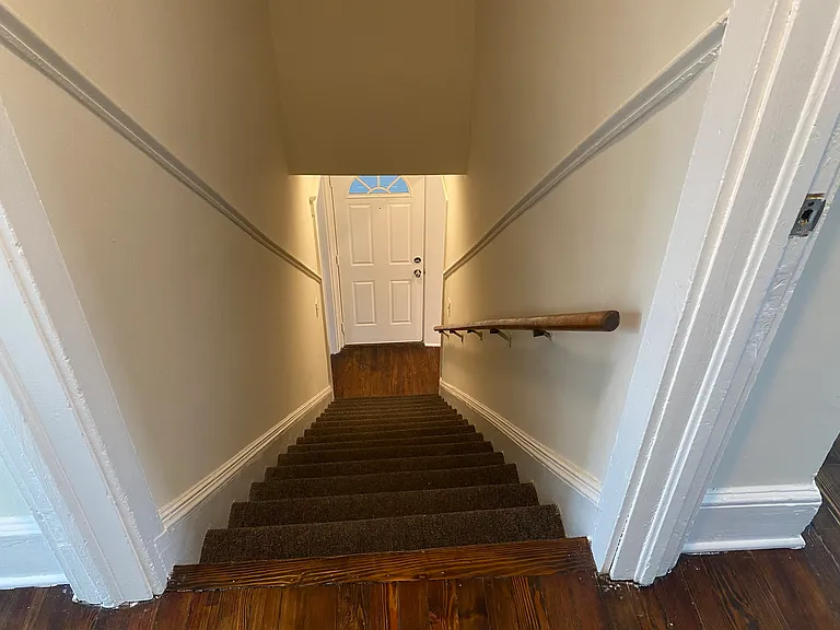 stairs with second floor bedrooms on either side