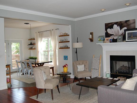 front door view: living room flows into dining room and kitchen