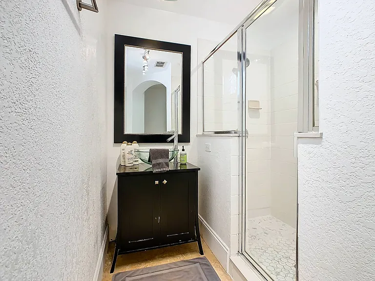 Indulge in the luxury of a shower and bathtub combo, creating a serene oasis for your ultimate comfort.