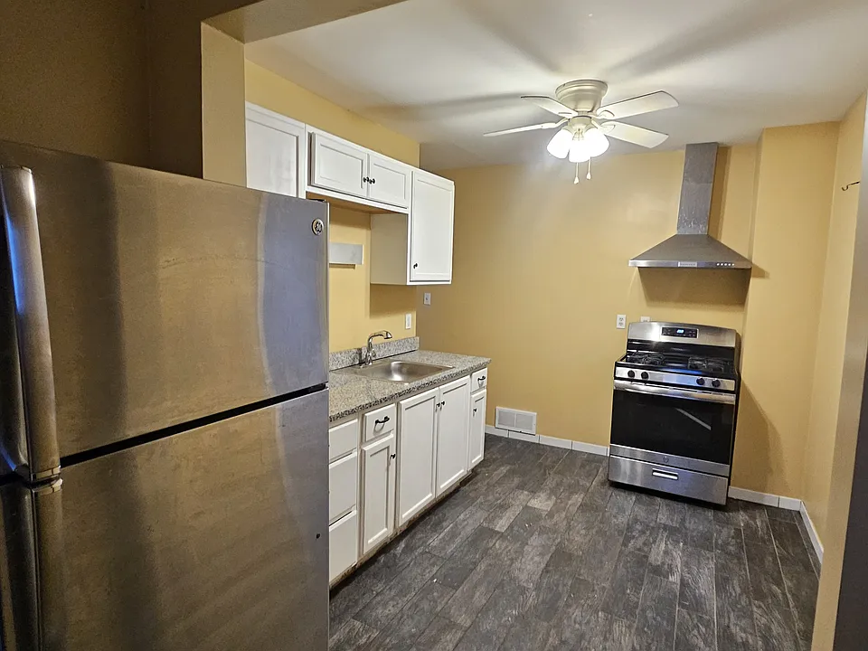 stainless stove and refrigerator in the kitchen