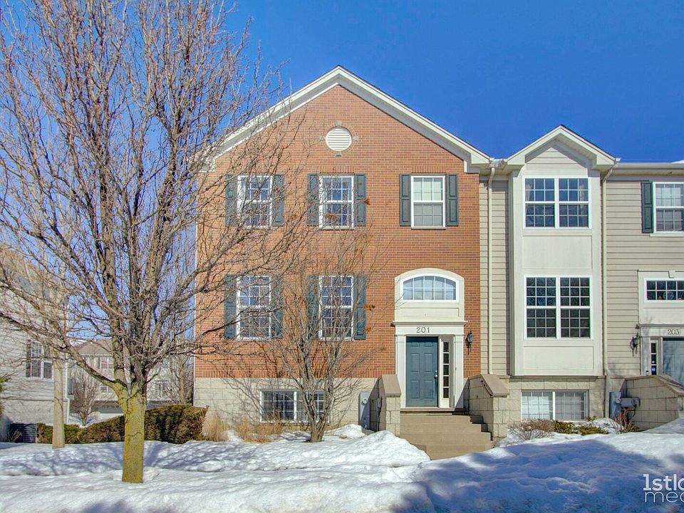 Welcome to 201 Comstock, a sunny end unit in Shadow Hill