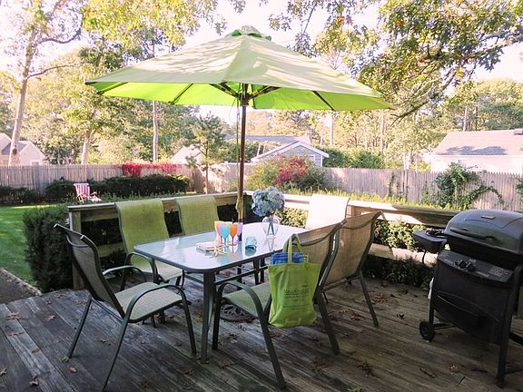 Deck off Kitchen with patio set, umbrella and grill