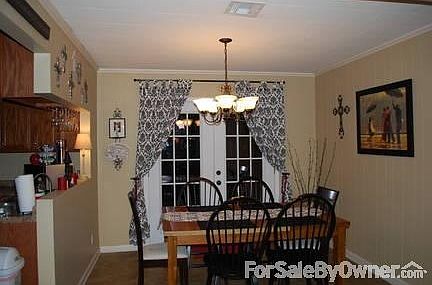 Dining Area with French Doors that overlook backyard
