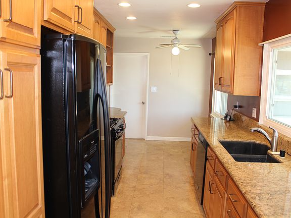 Kitchen with stove, refrigerator, dishwasher & microwave