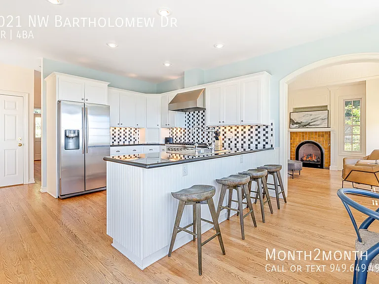 9021 NW Bartholomew Dr — Photo 28