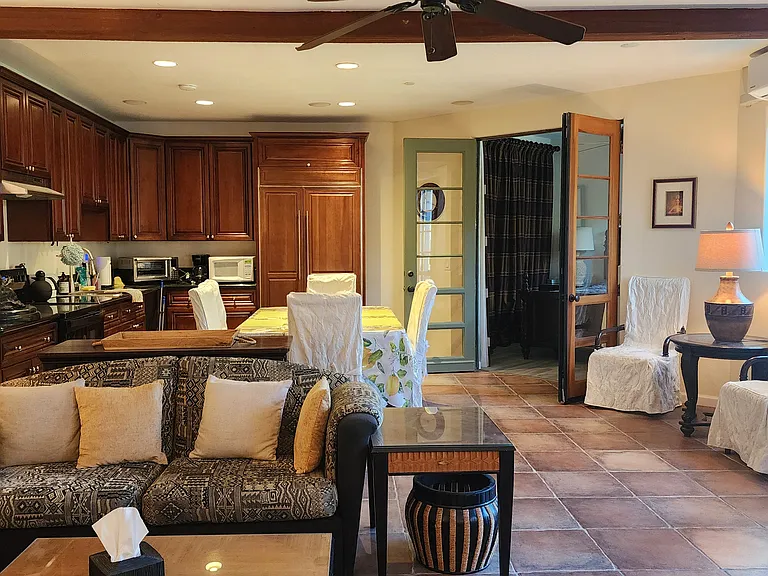 full kitchen with electric oven and range, full-size fridge and freezer.