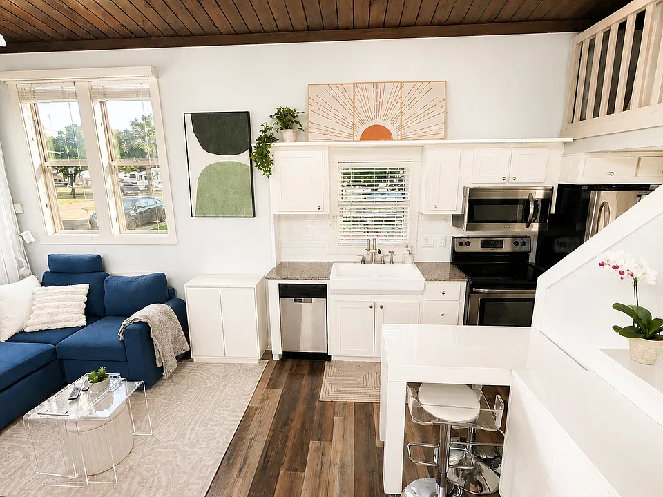 Cook at home with a full kitchen, dishwasher, and farmhouse sink.