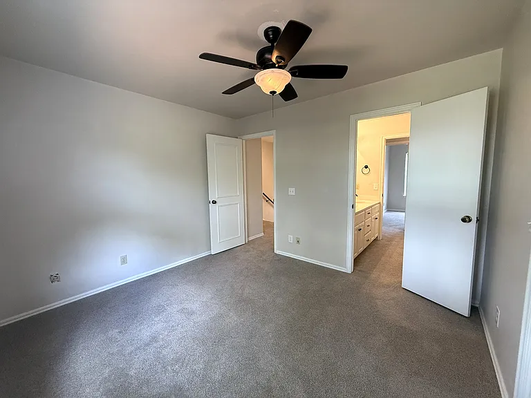 Second bedroom leading to the landing for the top of the stairs and the jack-n-jill bathroom.