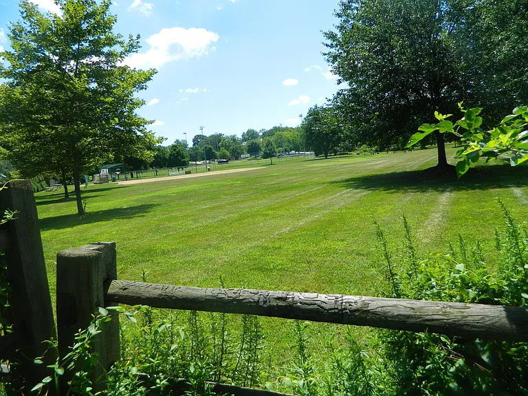 beyond back yard is a whitemarsh park