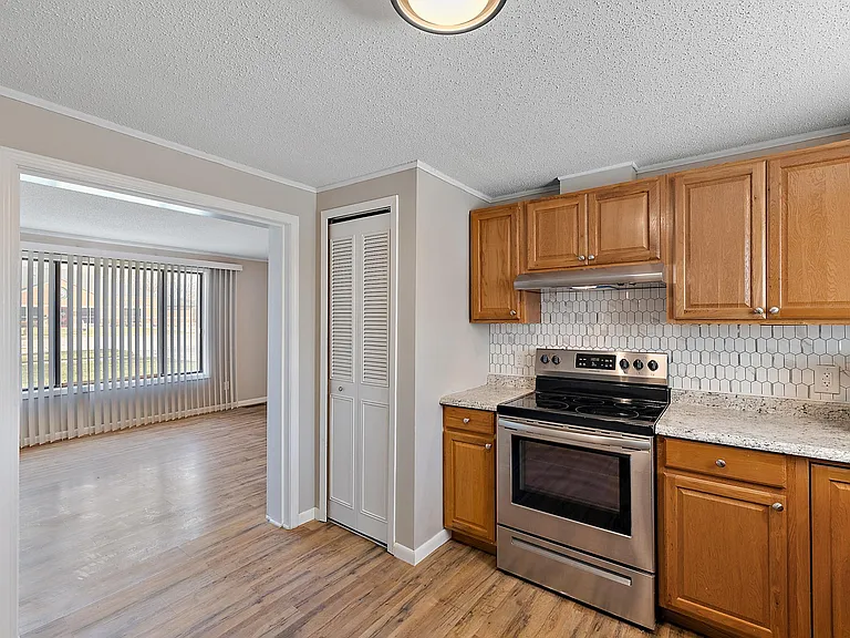Kitchen is open to the living room. Utility closet next to stove