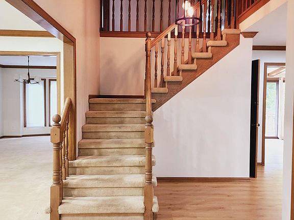 Open floor plan with living room, dining room, kitchen and large first floor