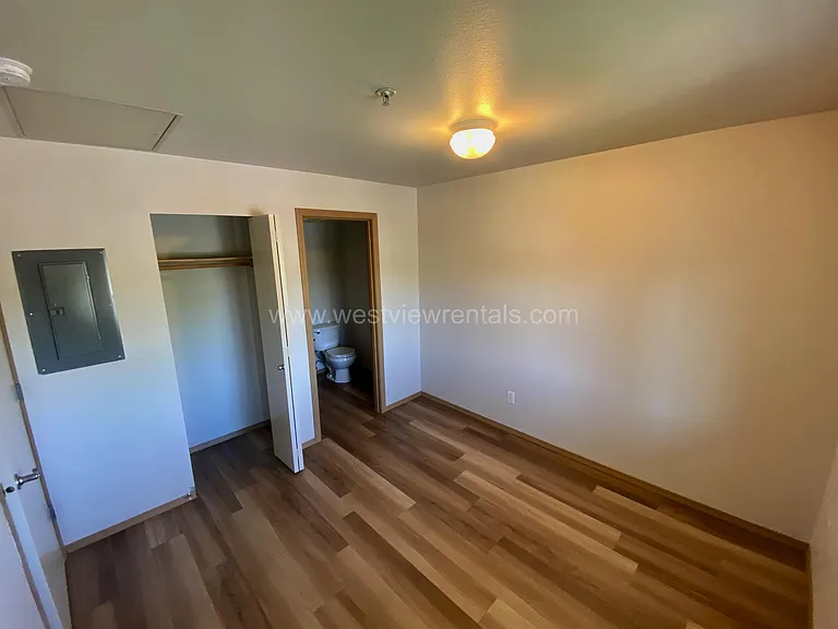 main bedroom with attached half-bath