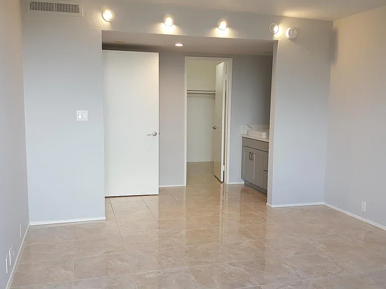 Master bedroom with large walk_in closet and en_suite bathroom