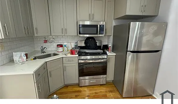 11339 Farmers Blvd #1 — Photo 3