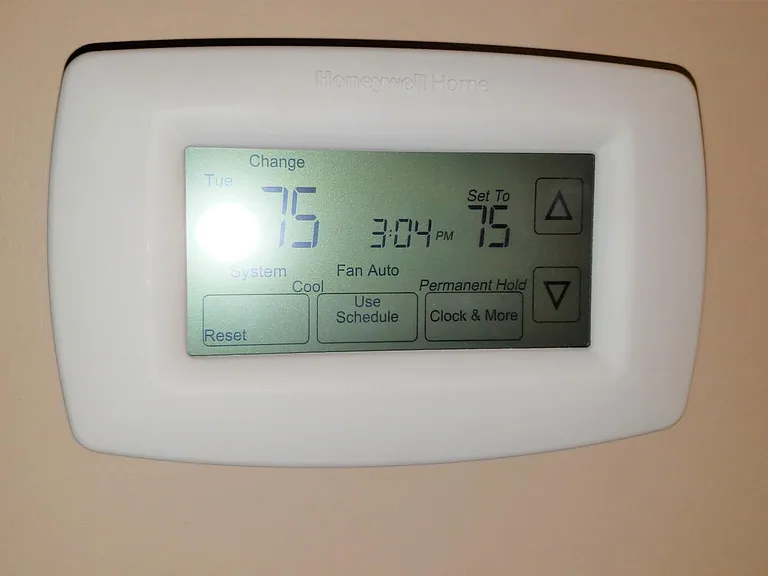 New programable thermostat helps keep utility bills low