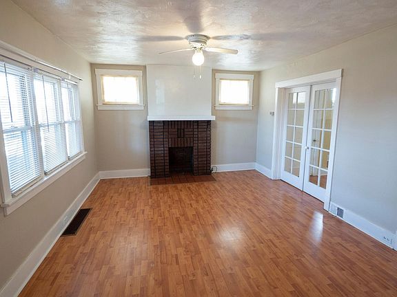 Elegant Living room, gorgeous wood floors, decorative fire p