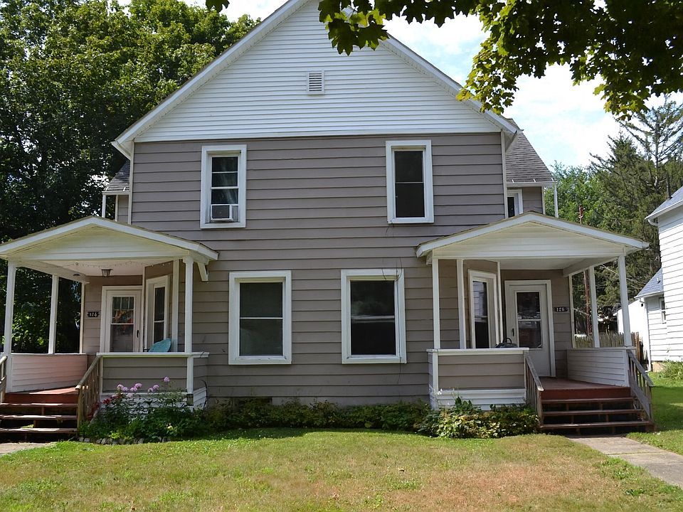 Charming two-story home with a covered front porch on each side, mature landscaping, and classic architectural details. Situated in a desirable neighborhood with plenty of curb appeal. Private off street parking